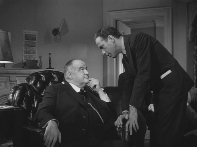 Humphrey Bogart (standing) makes a deal with Sidney Greenstreet. Image: 